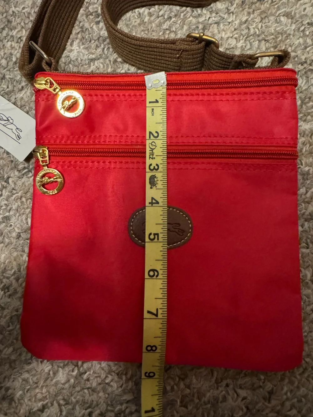 Longchamp Red Crossbody Bag with Brown Strap and Gold Accents